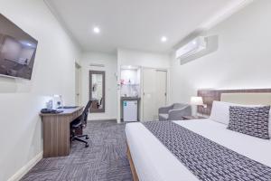 En eller flere senge i et værelse på Best Western Melbourne Airport