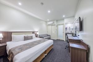 En eller flere senge i et værelse på Best Western Melbourne Airport