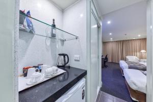 En eller flere senge i et værelse på Best Western Melbourne Airport