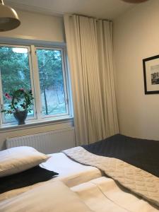 Postel nebo postele na pokoji v ubytování Sjövillan B&B