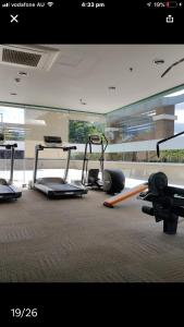 a gym with several exercise equipment in a room at Fantastic Affordable high end condominium heart of the Cebu city in Cebu City