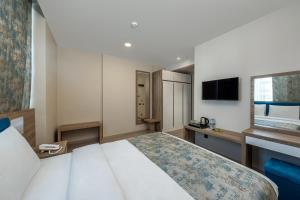 Postel nebo postele na pokoji v ubytování Anelli Hotel