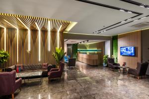 TV a/nebo společenská místnost v ubytování Anelli Hotel