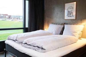 Postel nebo postele na pokoji v ubytování Hotel GUESTapart