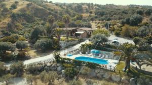 an aerial view of a resort with a swimming pool at Villa Romeo - Alloggio Pastore - Private Pool in Santa Caterina dello Ionio