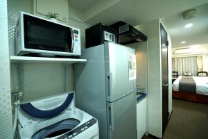 Kuchyň nebo kuchyňský kout v ubytování Le Tour Hotel Akihabara Ekimae 楽途ホテル秋葉原駅前店