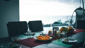 a table with a plate of fruit on it at Pacific View Dalaguete in Dalaguete