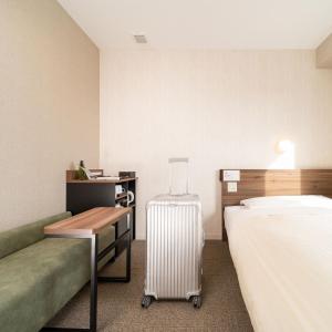 Postel nebo postele na pokoji v ubytování Super Hotel Joetsu Myoko-Eki Nishiguchi + 37 fotografií