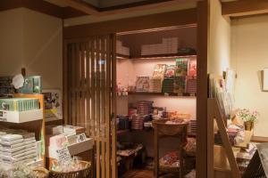 
a kitchen filled with shelves and shelves filled with food at Shosenkaku Kagetsu in Yuzawa
