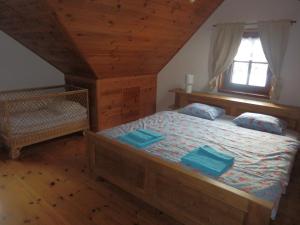 Postel nebo postele na pokoji v ubytování Pension Cortina
