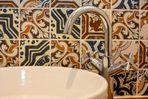 a bathroom with a sink and a faucet at Gelly Cott in Padstow +23 photos