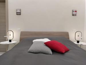 A bed or beds in a room at Villa Joy - Iconic Heritage Rooms