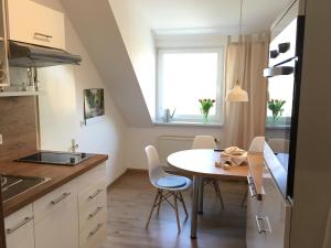 A kitchen or kitchenette at Apartments am Park