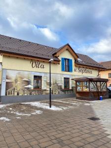 a building with a mural on the side of it at Vila U Septima in Poprad