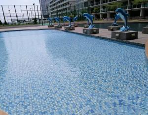 a swimming pool with blue dolphin statues in a building at Johor Austin TOPPEN Romantic 2pax WIFI Homestay in Johor Bahru