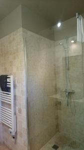 a bathroom with a shower with a glass door at Un Coin De Luberon in L'Isle-sur-la-Sorgue +34 photos