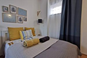 Łóżko lub łóżka w pokoju w obiekcie Teubel apartman 5