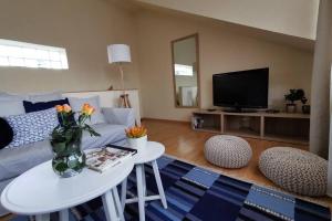 Telewizja i/lub zestaw kina domowego w obiekcie Teubel apartman 5