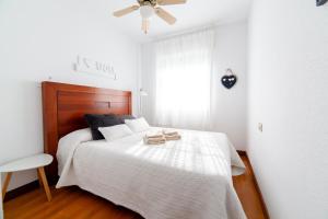 Łóżko lub łóżka w pokoju w obiekcie Merecido Descanso Sun Beach