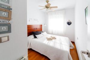 Łóżko lub łóżka w pokoju w obiekcie Merecido Descanso Sun Beach