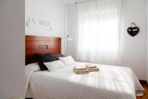 Łóżko lub łóżka w pokoju w obiekcie Merecido Descanso Sun Beach