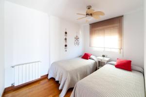 Łóżko lub łóżka w pokoju w obiekcie Merecido Descanso Sun Beach