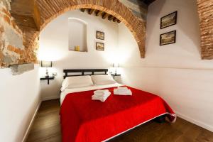 A bed or beds in a room at Medici Soderini