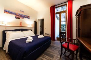 A bed or beds in a room at Medici Soderini