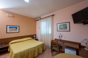 Postel nebo postele na pokoji v ubytování Valle Degli Ulivi + 24 fotografií