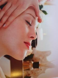a woman with her hands on her face at Viva B&B in Anavyssos