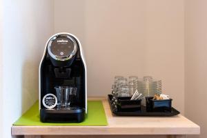 a black blender sitting on a wooden table at Medici Soderini in Florence