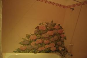 a bathroom with a pineapple painting on the wall at Hotel Sintra Jardim in Sintra