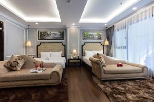 Postel nebo postele na pokoji v ubytování Babylon Premium Hotel & Spa