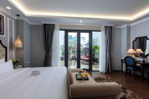 Postel nebo postele na pokoji v ubytování Babylon Premium Hotel & Spa