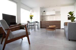 a living room with a couch and a dining room at Balcón del Albayzín in Salobreña +10 photos