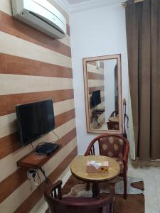 TV a/nebo společenská místnost v ubytování Beit Almurooj Hotel Apartment
