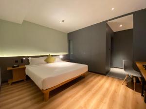Voodi või voodid majutusasutuse Yunfan Hotel toas