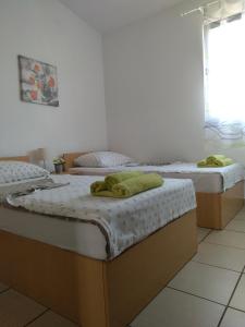 Postel nebo postele na pokoji v ubytování Apartments Teami