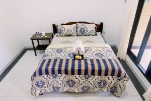 Кровать или кровати в номере Gili Sari Homestay