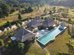 an aerial view of a house with a swimming pool at Hideaway in Chiang Mai