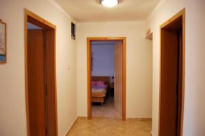 Postel nebo postele na pokoji v ubytování Omega Apartments