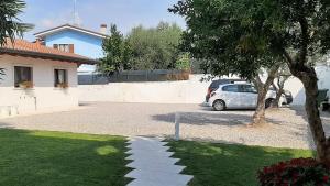 a car parked in a driveway next to a house at Corte Mantovani in Colà di Lazise
