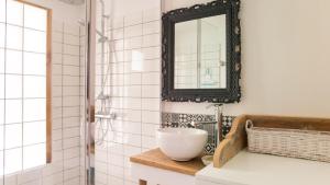 a bathroom with a sink and a mirror at Ravissante maison 300 Mètres de la plage in Notre-Dame-de-Monts +37 photos