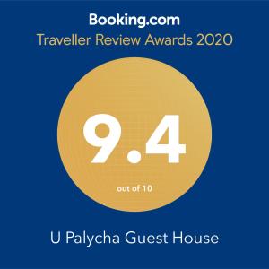 a sign that reads traveler review awards with a yellow circle at U Palycha Guest House in Sukhum