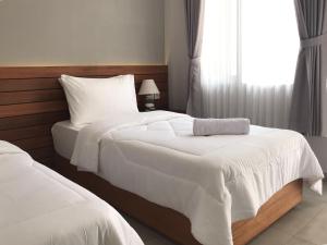 Letto o letti in una camera di Mantra Gili