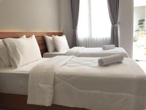 Letto o letti in una camera di Mantra Gili