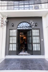 an entrance to a building with an open door at 87 Oldtown at River Pier in Bangkok
