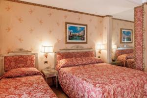Postelja oz. postelje v sobi nastanitve Hotel Venezia + 36 fotografij