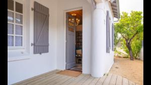 an open door to a house with a porch at Ravissante maison 300 Mètres de la plage in Notre-Dame-de-Monts