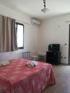 Postel nebo postele na pokoji v ubytování Masseria Prisuti